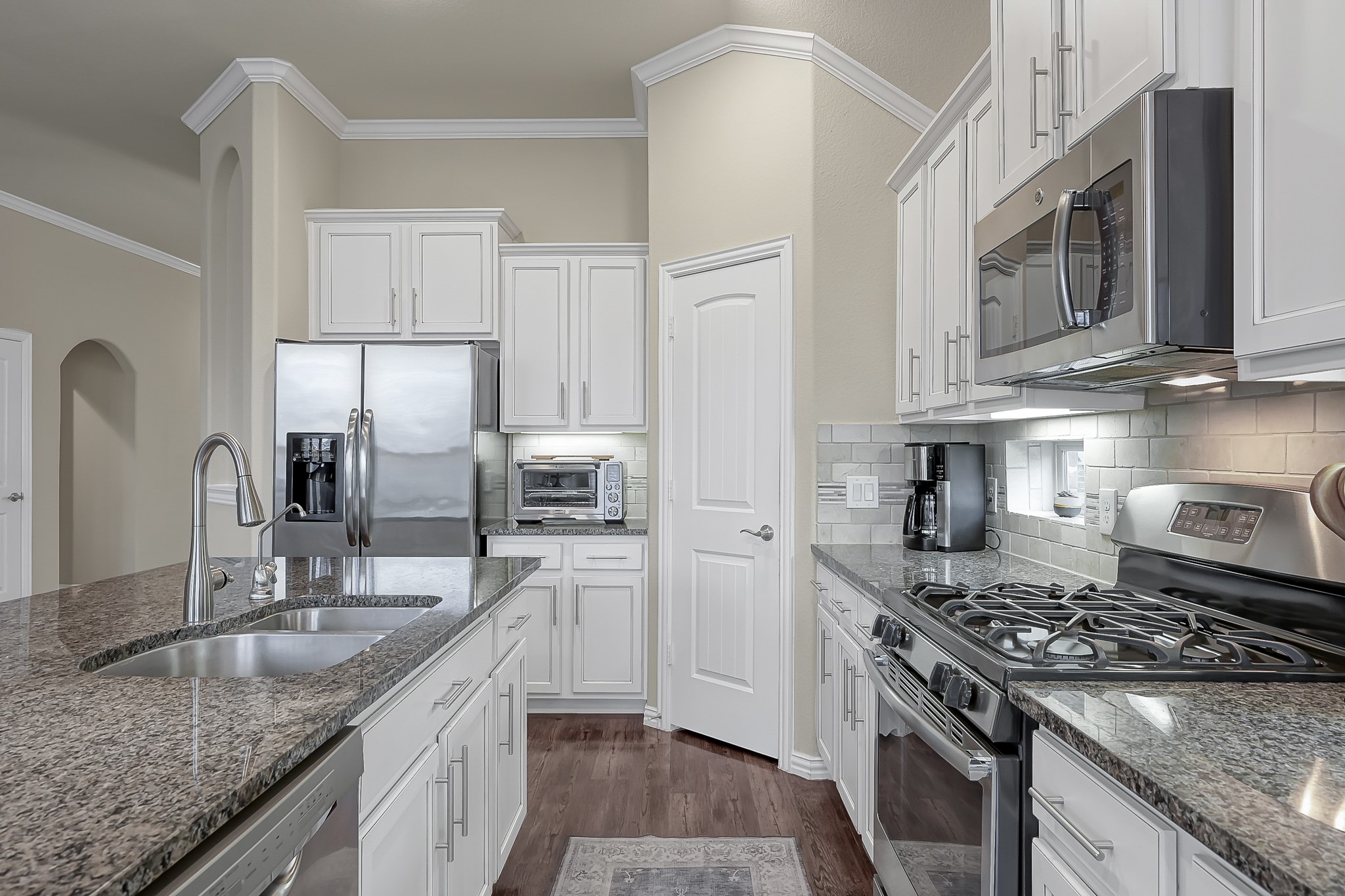 31711 Morning Ridge Lane Spring, TX 77386 - Photo 20 of 44 Chef's Kitchen with large island, granite countertops, and stainless appliances.