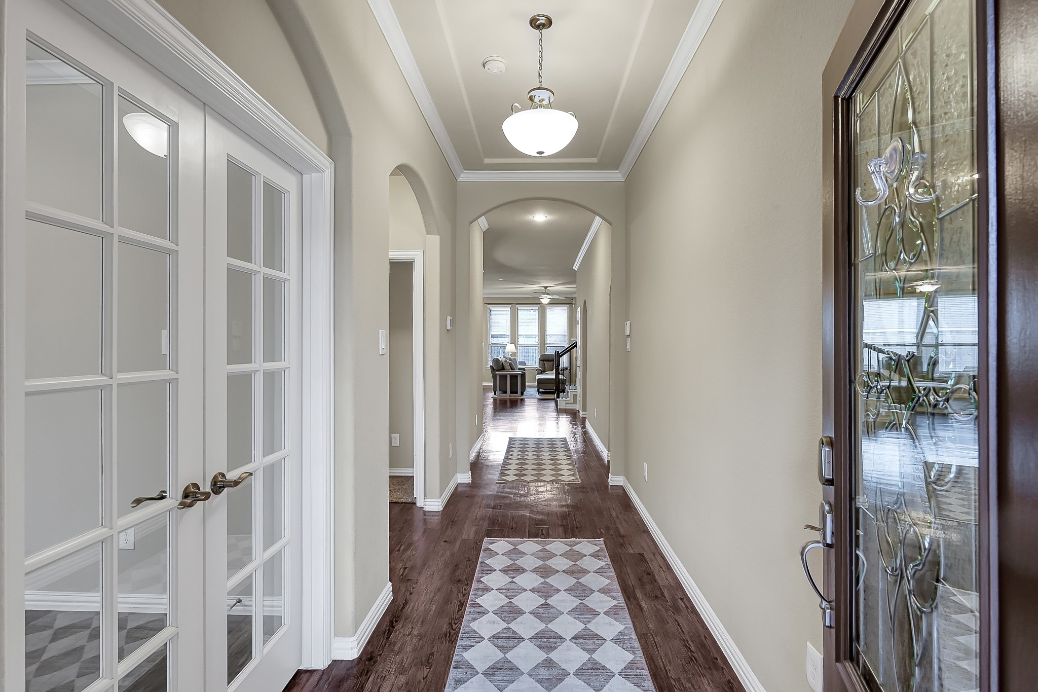 31711 Morning Ridge Lane Spring, TX 77386 - Photo 3 of 44 Sophisticated entry hallway featuring arched openings. Study / office is to the left as you walk into the foyer.