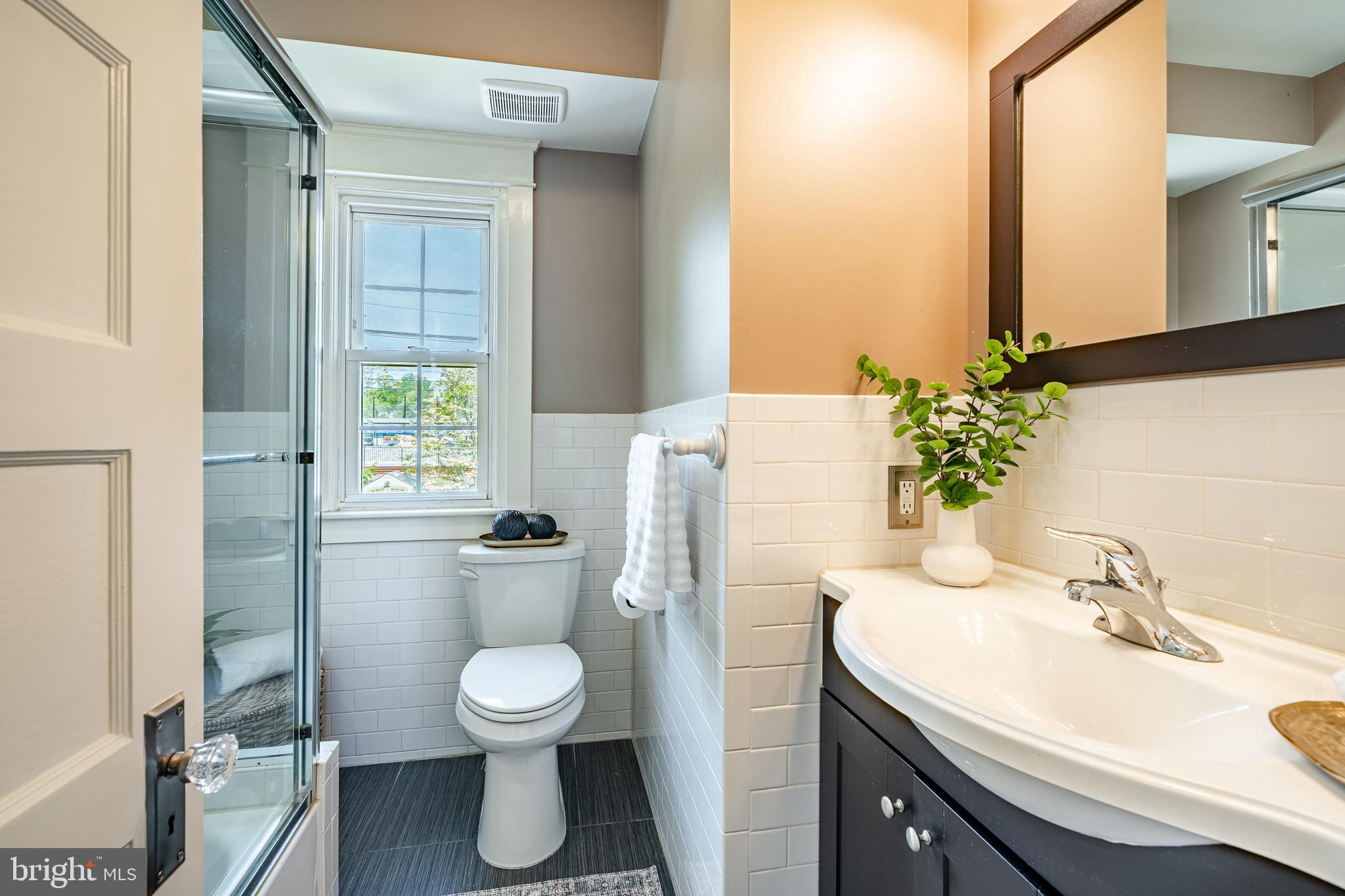240 Ballymore Road Springfield, PA 19064 - Photo 12 of 33 a bathroom with a sink toilet and a mirror