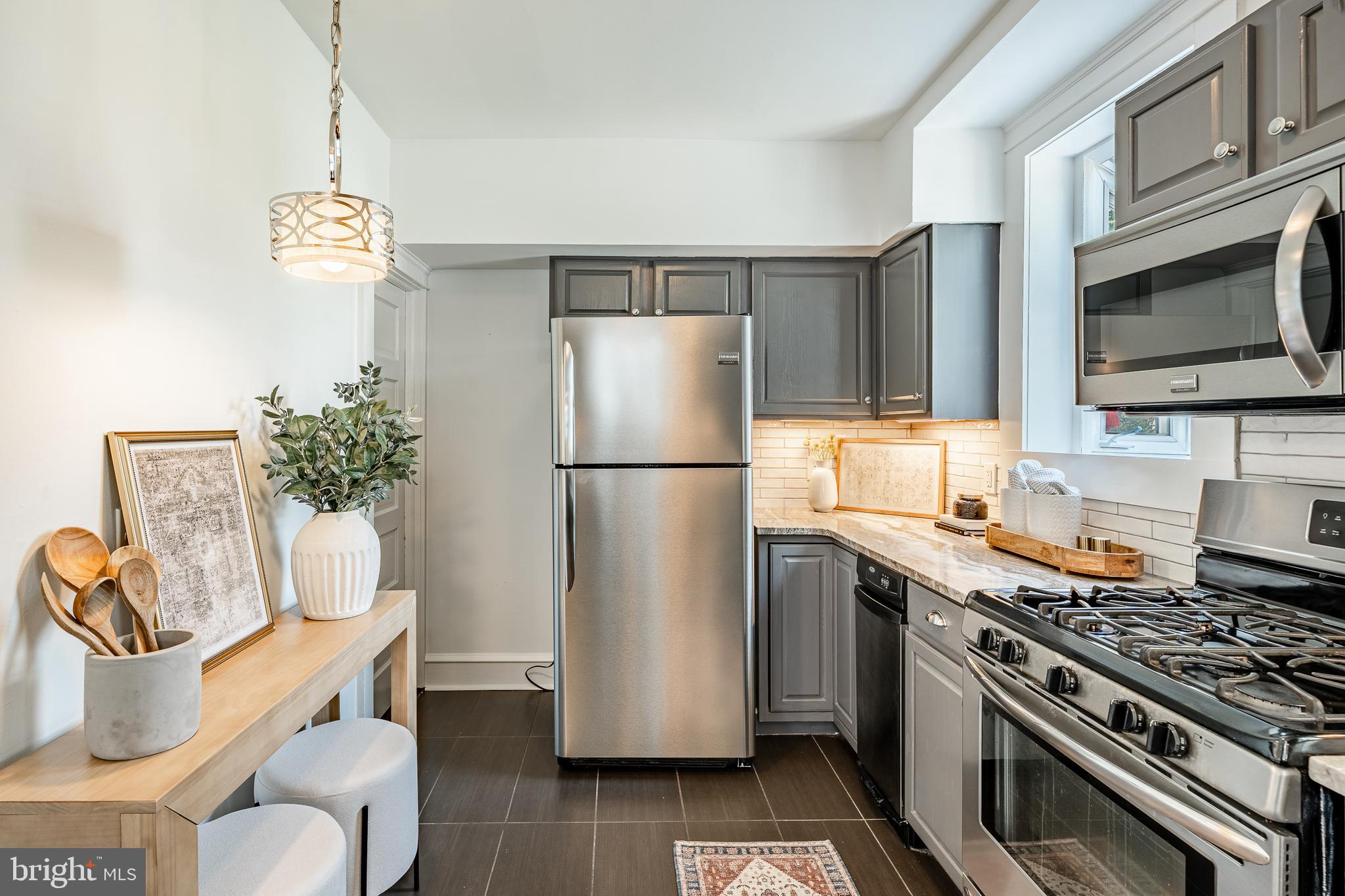 240 Ballymore Road Springfield, PA 19064 - Photo 15 of 33 a kitchen with a refrigerator and a stove