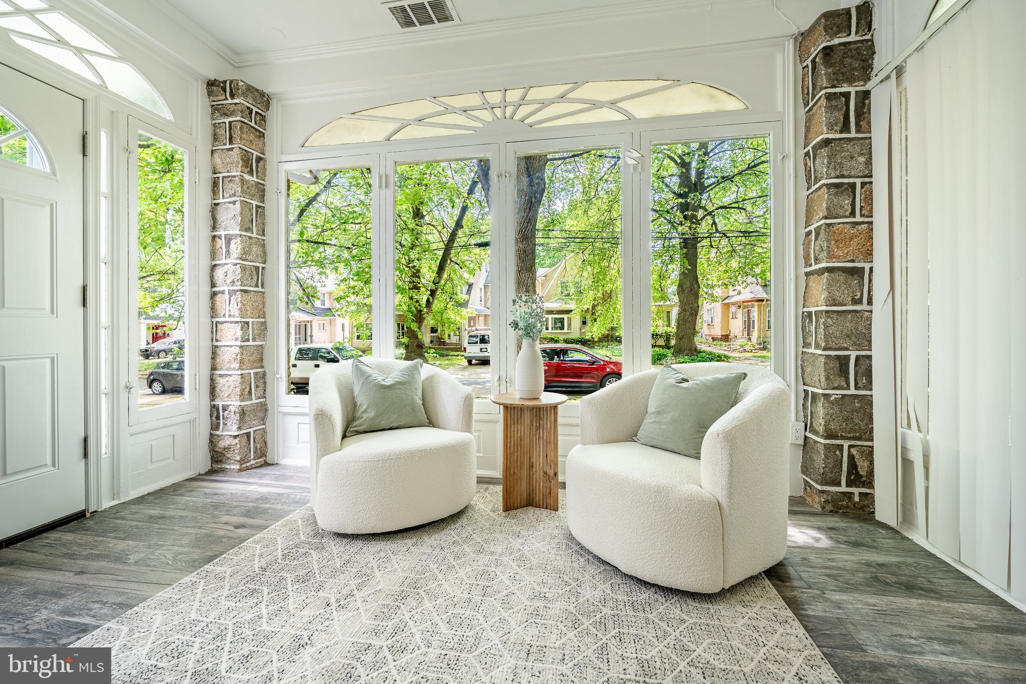 240 Ballymore Road Springfield, PA 19064 - Photo 5 of 33 a living room with furniture and a large window