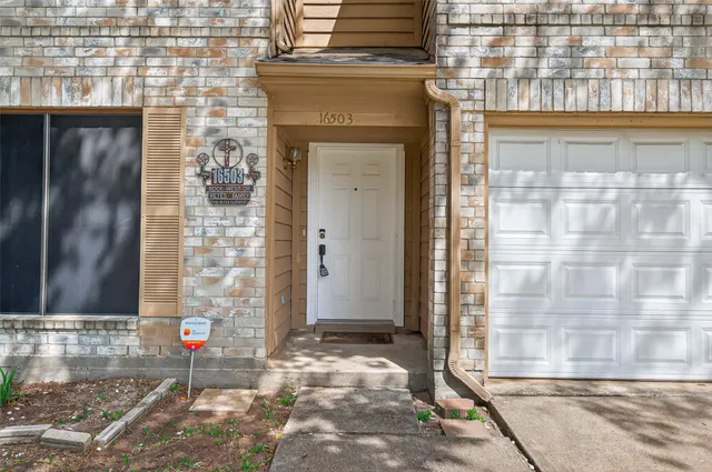 a view of a brick building with a street sign