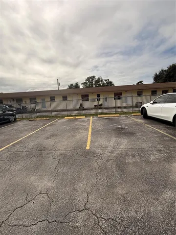 a view of car parked on road with city view