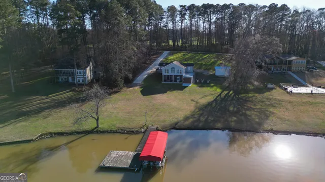 a aerial view of a house with a yard