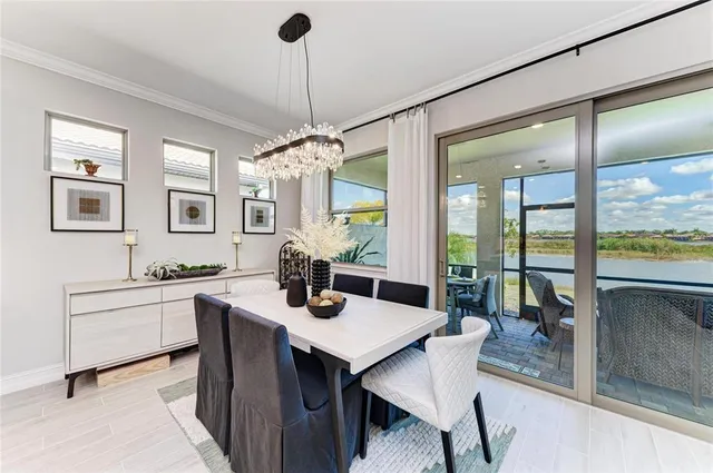 a kitchen with sink a microwave and cabinets