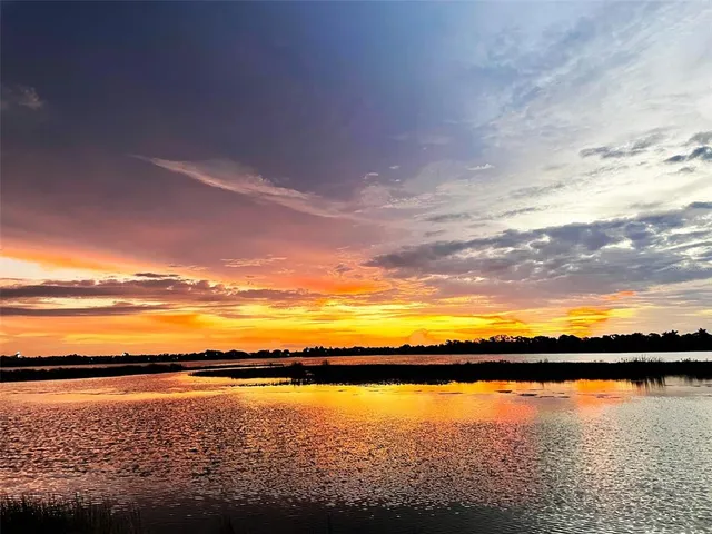 a view of walk in closet with clothes