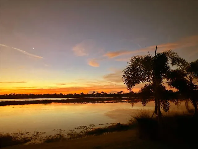 a bedroom with a bed and a chair