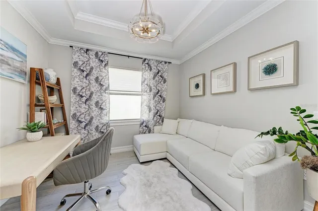 a view of a street with a cars parked and small park