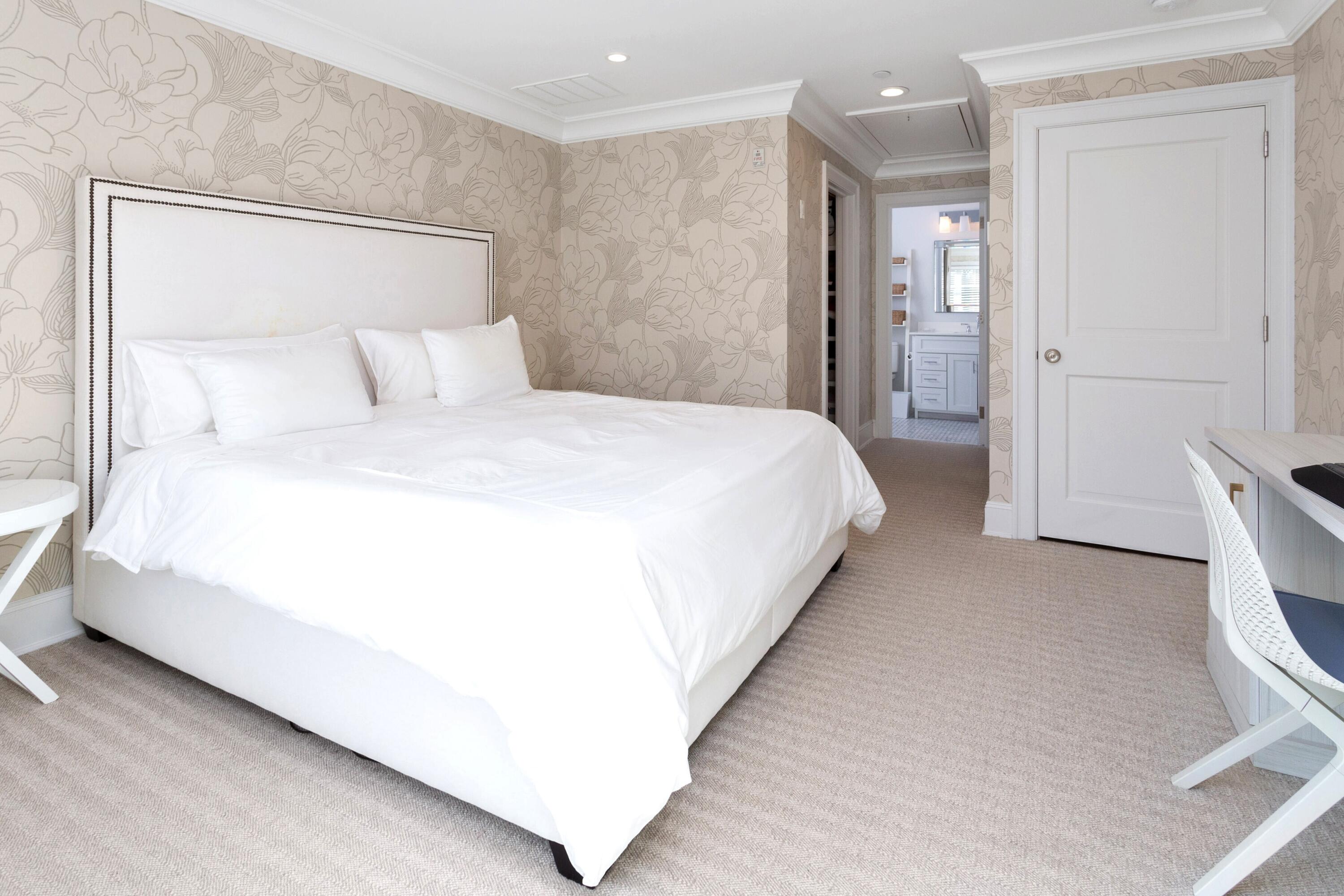 71 Rowayton Avenue, Unit 7 Rowayton, CT 06853 - Photo 16 of 31 a bedroom with a bed and a mirror