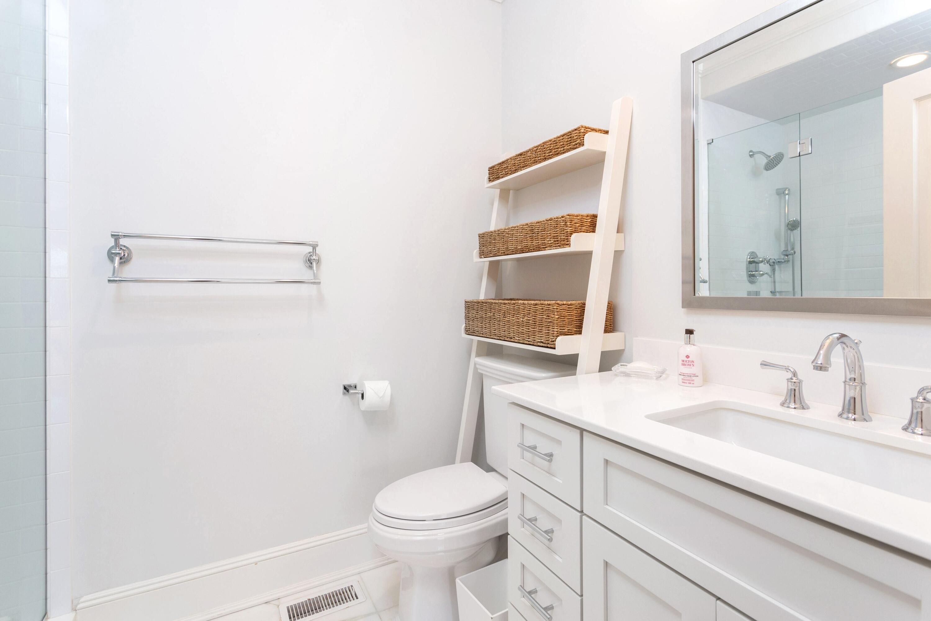 71 Rowayton Avenue, Unit 7 Rowayton, CT 06853 - Photo 22 of 31 a bathroom with a granite countertop sink mirror vanity and toilet