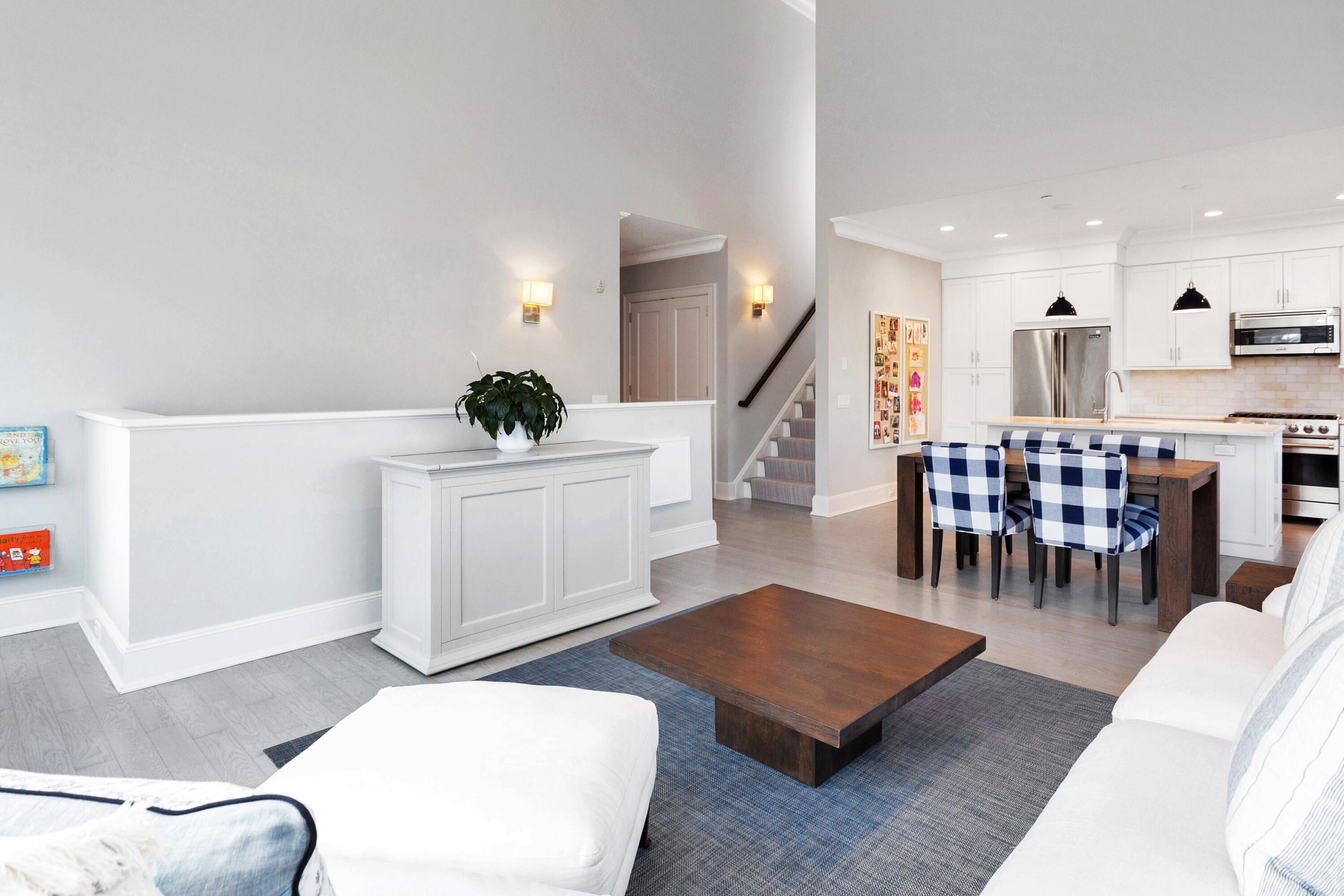 71 Rowayton Avenue, Unit 7 Rowayton, CT 06853 - Photo 7 of 31 a living room with furniture and a dining table with kitchen view
