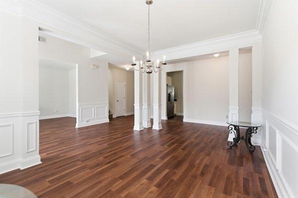 4925 Locherby Drive Fairburn, GA 30213 - Photo 12 of 85 a view of a room with wooden floor and staircase