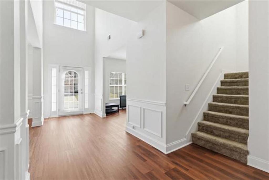4925 Locherby Drive Fairburn, GA 30213 - Photo 13 of 85 a view of an entryway with wooden floor and door