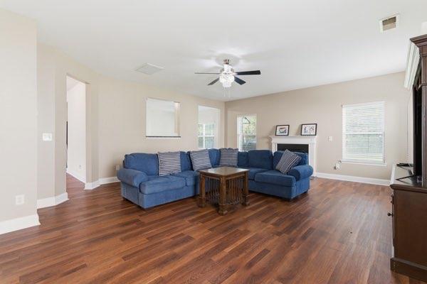 4925 Locherby Drive Fairburn, GA 30213 - Photo 26 of 85 a living room with furniture and a wooden floor