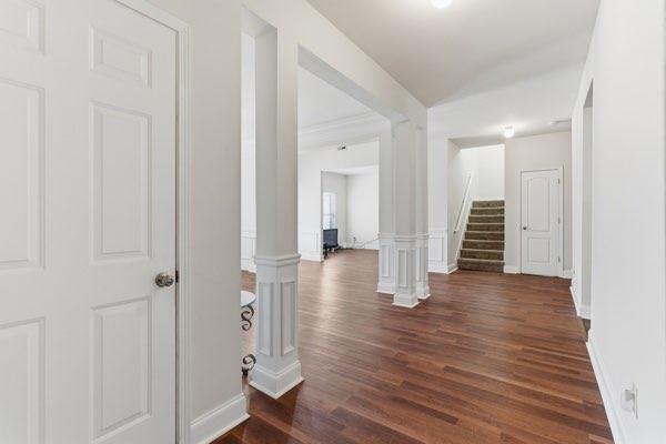 4925 Locherby Drive Fairburn, GA 30213 - Photo 31 of 85 wooden floor with a view of a hallway with wooden floor