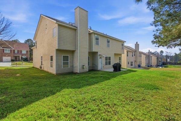 4925 Locherby Drive Fairburn, GA 30213 - Photo 32 of 85 a view of a house with backyard