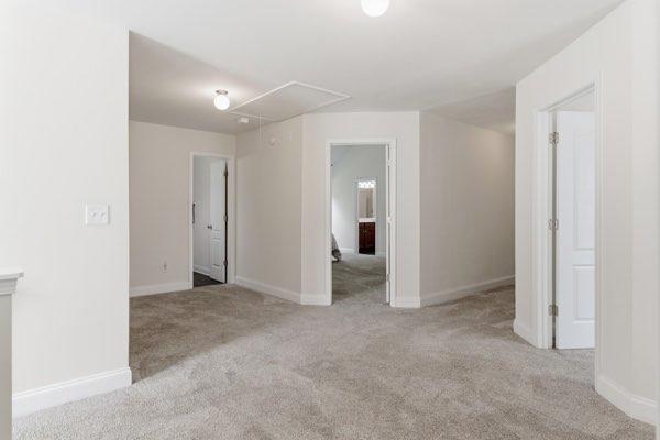 4925 Locherby Drive Fairburn, GA 30213 - Photo 33 of 85 an empty room with closet and a bathroom