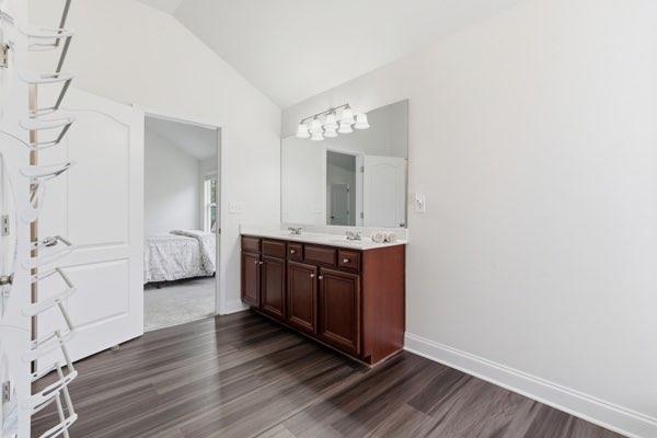 4925 Locherby Drive Fairburn, GA 30213 - Photo 52 of 85 a bathroom with a double vanity sink and mirror