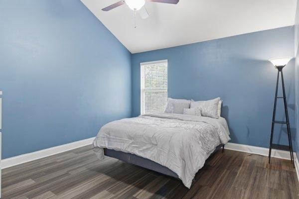 4925 Locherby Drive Fairburn, GA 30213 - Photo 58 of 85 a bedroom with a bed and wooden floor