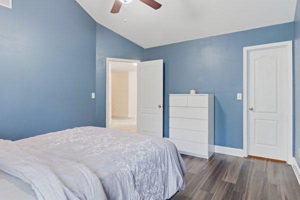 4925 Locherby Drive Fairburn, GA 30213 - Photo 59 of 85 a bedroom with a bed and wooden floor