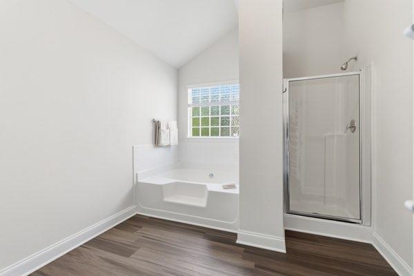 4925 Locherby Drive Fairburn, GA 30213 - Photo 71 of 85 a view of an empty room with wooden floor and a window