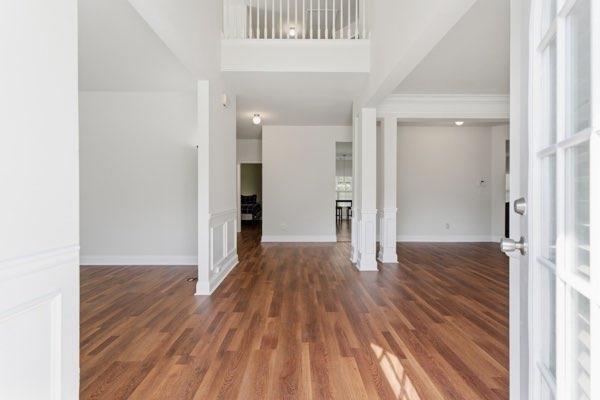 4925 Locherby Drive Fairburn, GA 30213 - Photo 8 of 85 a view of a hallway with wooden floor