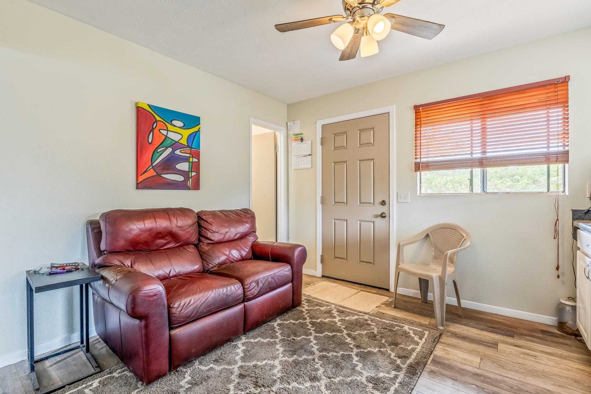 1156 South Kihei Road Kihei, HI 96753 - Photo 12 of 25 a living room with furniture and a window