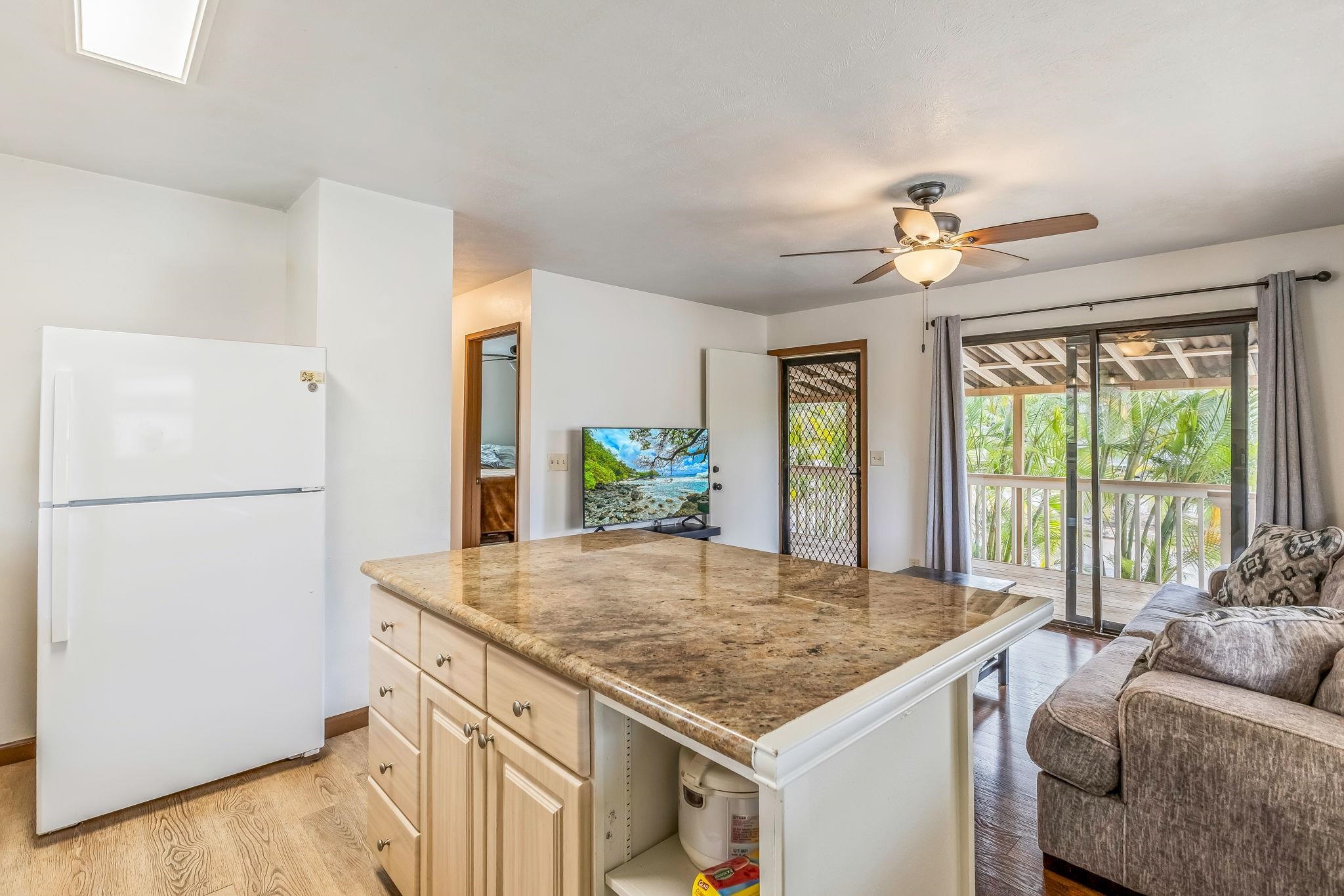 1156 South Kihei Road Kihei, HI 96753 - Photo 16 of 25 a view of kitchen island a sink and living room