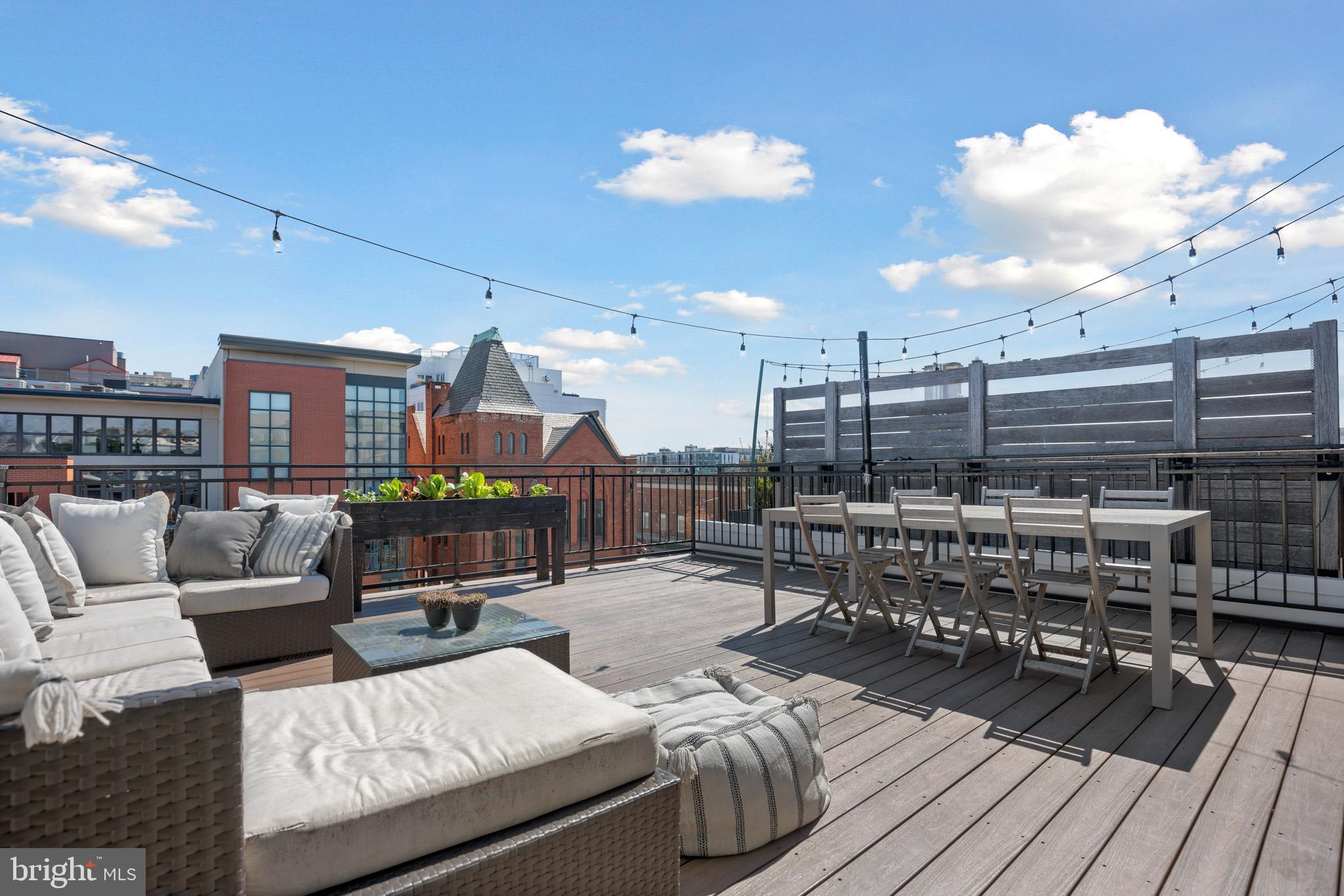 a view of a roof deck with couches
