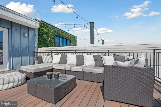 a living room with furniture and a rug