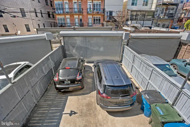 a view of a patio with table and chairs