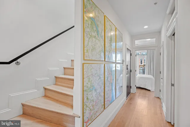 a view of entryway with wooden floor and stairs