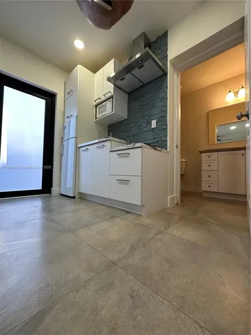 a kitchen with a stove and a sink