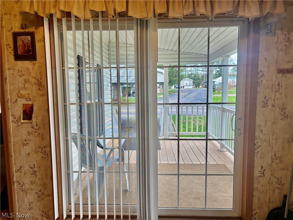 5852 Cleveland Road, Unit 22 Wooster, OH 44691 - Photo 10 of 35 Sliding doors in kitchen lead to covered porch.