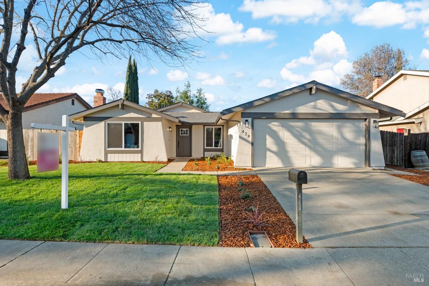 a front view of a house with yard