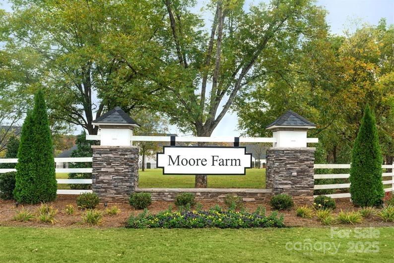 3008 Bramble Hedge Drive, Unit 3272 Indian Trail, NC 28079 - Photo 13 of 13 a sign on the side of a building