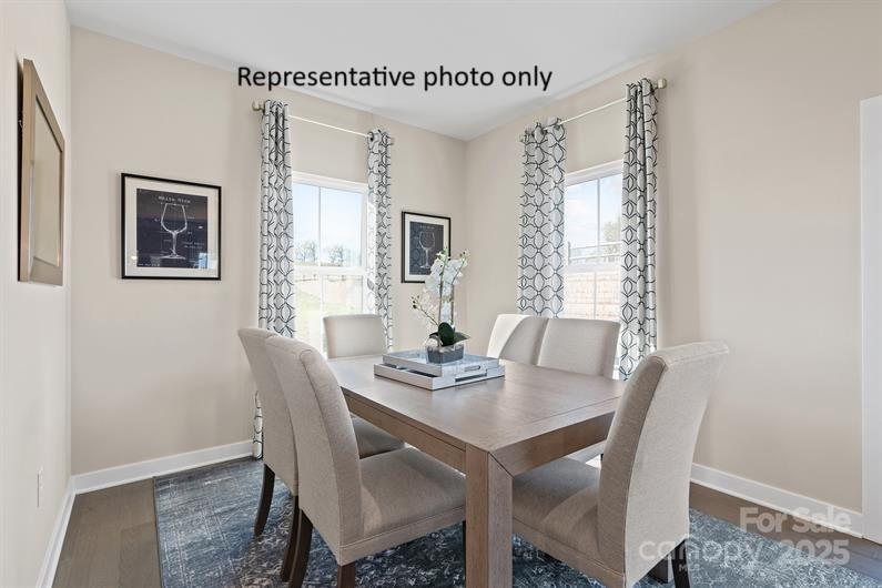 3008 Bramble Hedge Drive, Unit 3272 Indian Trail, NC 28079 - Photo 6 of 13 a view of a dining room with furniture and window
