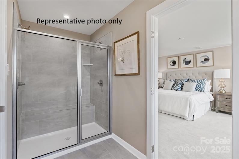 3008 Bramble Hedge Drive, Unit 3272 Indian Trail, NC 28079 - Photo 8 of 13 a en suite bathroom with a shower and a sink