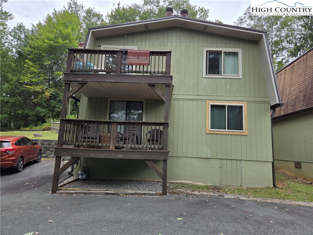a view of a house with large windows
