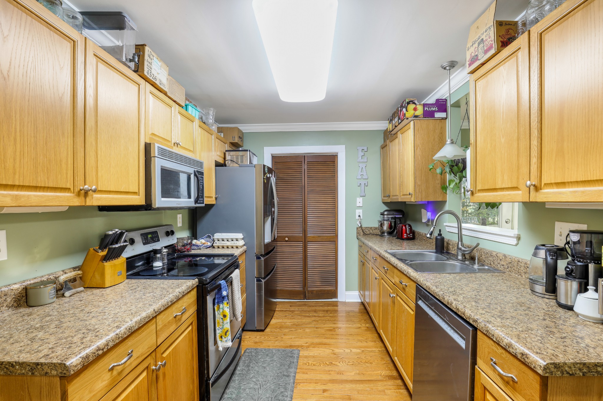1073 Rector Lane Springfield, TN 37172 - Photo 11 of 25 a kitchen with stainless steel appliances granite countertop sink stove top oven and cabinets