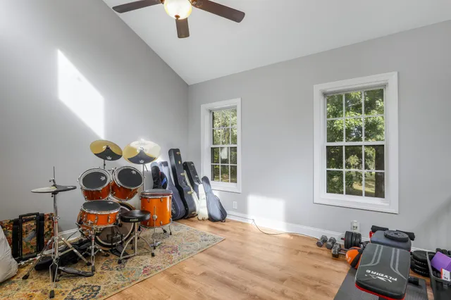 a bedroom with furniture and window