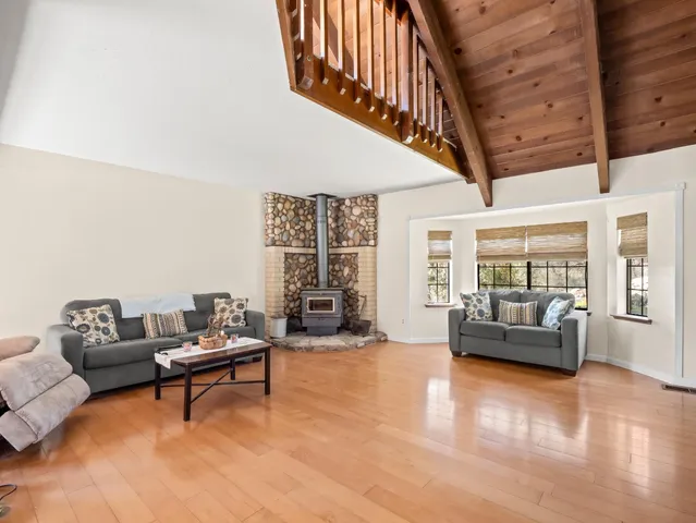 a bedroom with furniture and a window