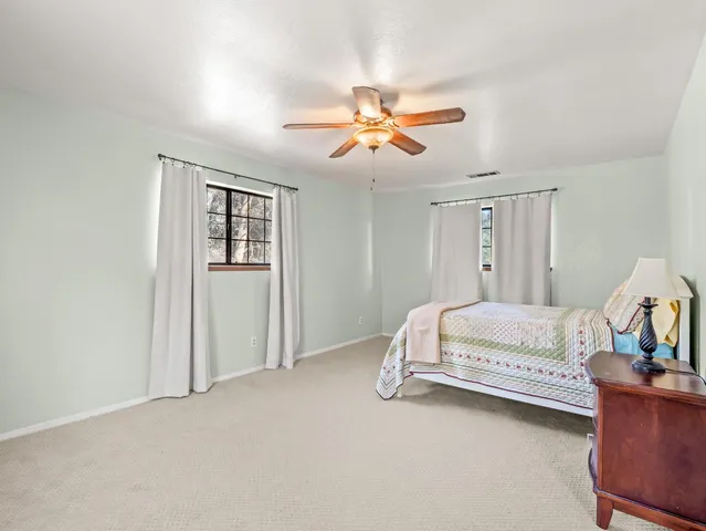 a bathroom with a double vanity sink mirror and double