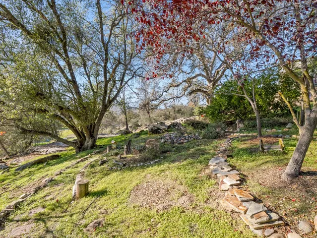 a backyard of a house with lots of green space
