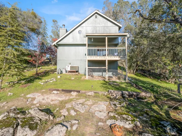a view of a field with a mountain in the background