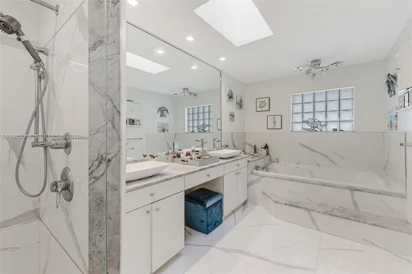 a bathroom with a sink and mirror