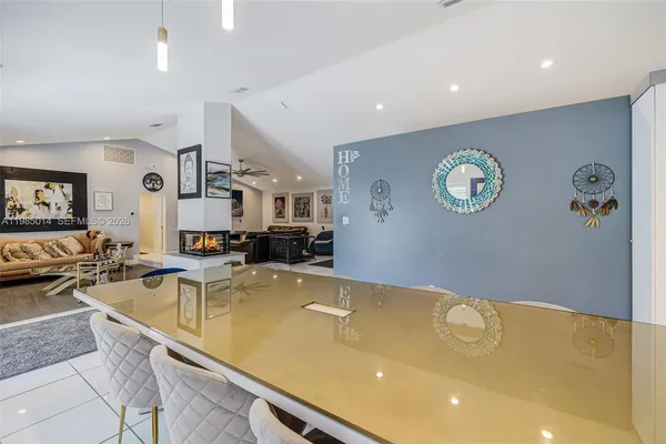 a very nice looking room with a large mirror and a clock on the wall