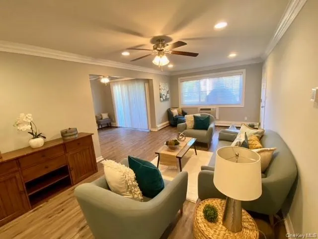 a living room with furniture and a large mirror