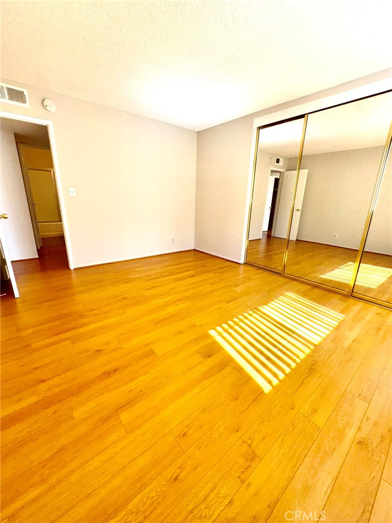 430 East San Jose Avenue, Unit F Burbank, CA 91501 - Photo 11 of 16 a view of an empty room with wooden floor