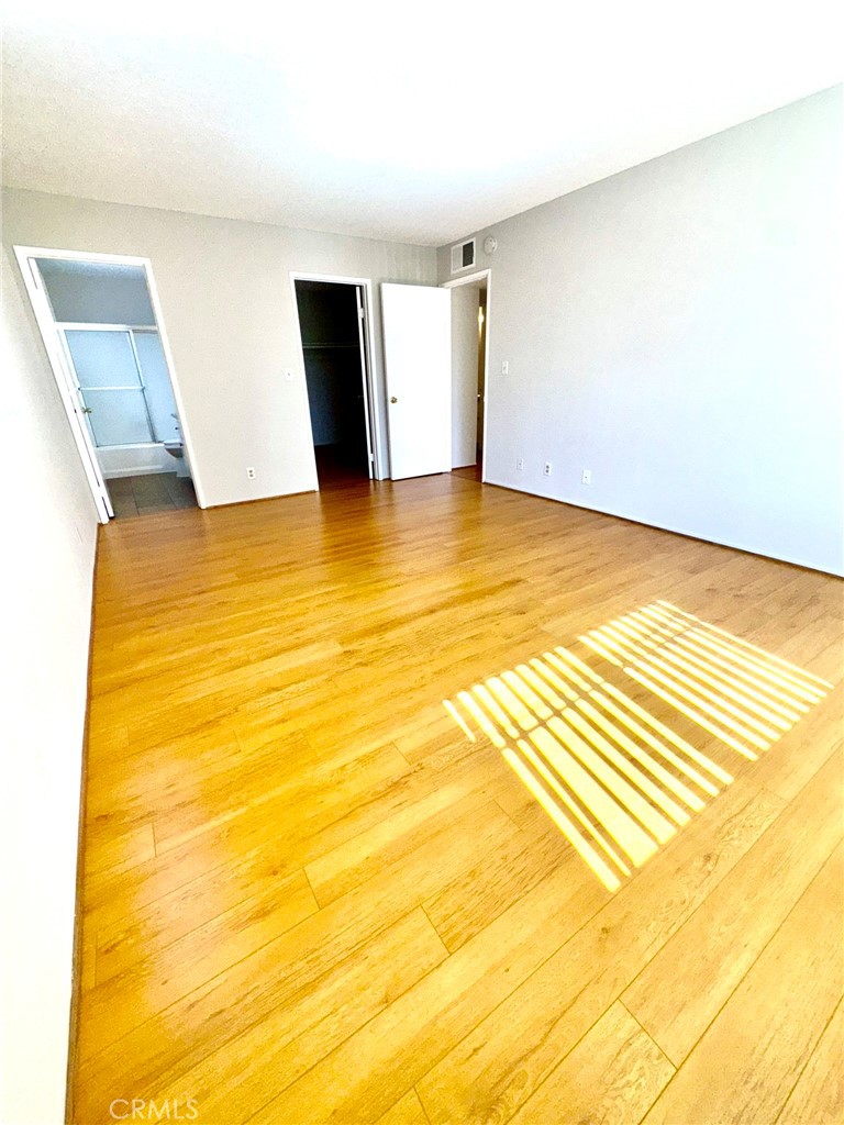 430 East San Jose Avenue, Unit F Burbank, CA 91501 - Photo 13 of 16 a view of an empty room with wooden floor